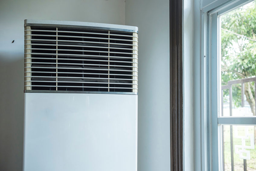 man installing air conditioner