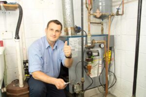 HVAC Technician fixing heating furnace