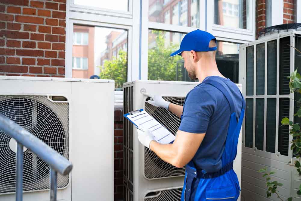 hvac technician checking hvac units